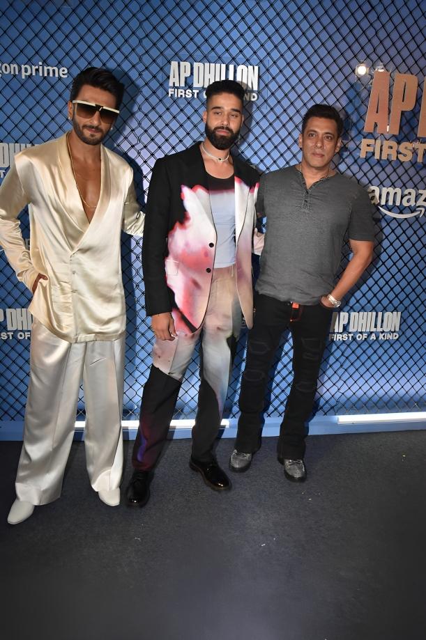 The three of them looked in high spirits as they posed for the flashing lights The three of them looked in high spirits as they posed for the flashing lights